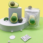 avocado catnip toy displayed with accessories and packaging on a colorful background